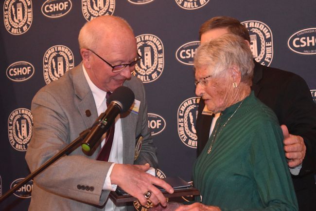 2024 inductee Judy Young is congratulated by CSHOF president Randy Anderson upon her enshrinement.