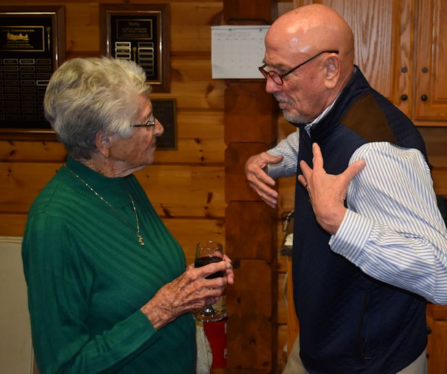 2024 inductee Judy Young chats with Jay Glatz before the banquet.