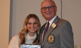 Southwestern first-team all-state volleyball player Lauren Cotter and CSHOF president Randy Anderson.