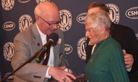 2024 inductee Judy Young is congratulated by CSHOF president Randy Anderson upon her enshrinement.