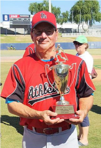 Charlie LaDuca holds the Men’s Senior Baseball League World Series championship trophy.