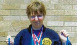 Christina Kebort displays her 7 World Championship medals.