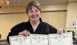 Christina Kebort was awarded 1st in Women’s Master Weapons & Kata,  2nd in Women’s Master 50+ Sparring and Overall Master Grand Champion Title.