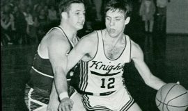 Dave Criscione (left) playing defense during his basketball career at Dunkirk High.