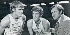 Donn Johnston, center,  with teammate George Karl (22) and North Carolina coach Dean Smith.