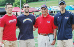 Fran Sirianni, second from right, stands with his sons, Mike, Nick and Jay, on the athletic complex at Southwestern Central School that bears his name. May 2015.