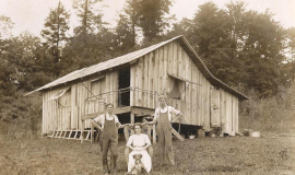 Howard (right) with his brother Charlie and Charlie's wife, Blanche, on the Ehmke property in Silver Creek.