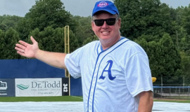 Bob Rosania, the owner of Ehmke Manufacturing Co., Philadelphia, admires the tarp used to cover the infield after a rain storm on Howard Ehmke Day at Diethrick Park. CSHOF inductee Howard Ehmke is widely credited with being the creator of the infield tarp for baseball. 