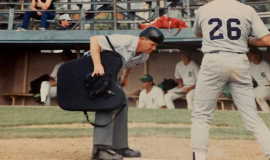 Larry Rodgers umpires a baseball game.