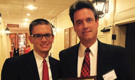 Scott Kindberg with his son Matthew and his AP first place award. 2015.