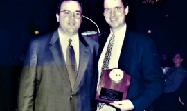 John Murphy with Scott Kindberg as he receives the Stan Barron Award. 2000.