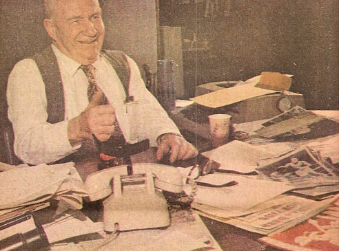 Frank Hyde at his desk before his retirement.