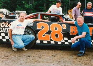 At right, Bob Schnars is pictured at far right with Dick Barton’s No. 28 car. Barton is pictured at left.