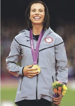 Fredonia native Jennifer Suhr poses with her gold medal for the women's pole vault in the Olympic Stadium at the 2012 Summer Olympics in London.