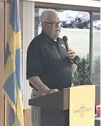 Chuck Crist  addresses  a gathering of the Norden  Club.