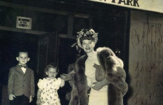 Lucille Ball poses with two young children at the Skateland Roller Rink in Celoron Park in the 1950s.