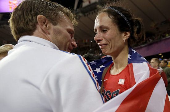 Jenn Suhr is congratulated by her husband and coach, Rick.