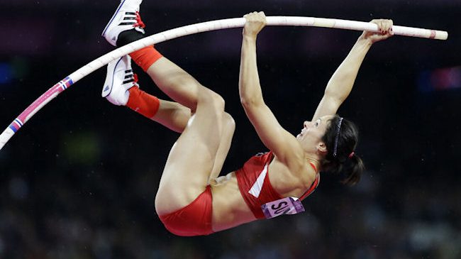 Jenn Suhr clears the bar to win gold.