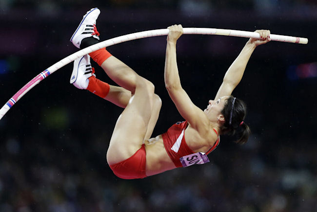 Jenn Suhr clears the bar to win gold.