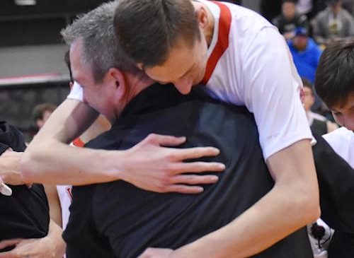 Salamanca’s Andy Herrick shares an embrace with his father.