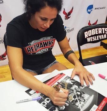 Jennifer Suhr signs an autograph.