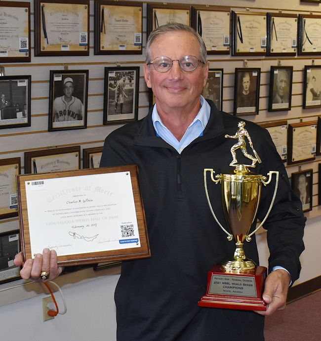 Charlie LaDuca shows off the Men’s Senior Baseball League Father/Son World Series championship trophy.