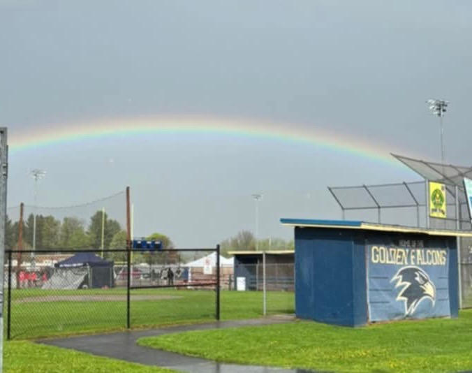 Hours after Saturday’s unveiling, a rainbow formed above Denny Meszaros Field. 
