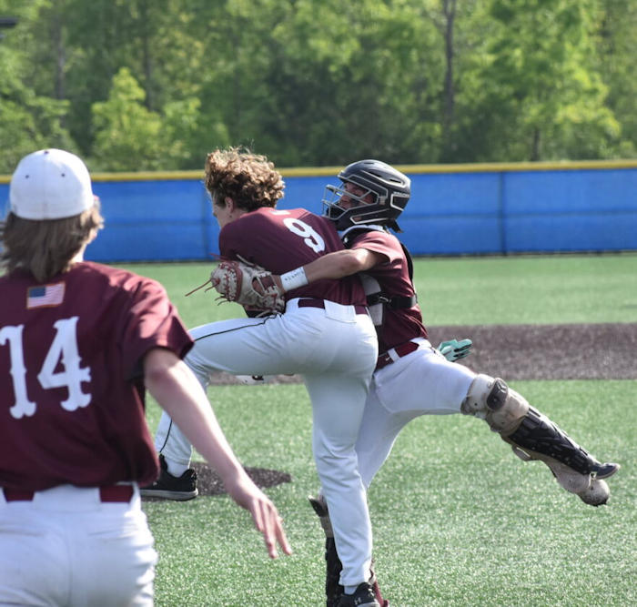 Marauders catcher Gabe Valentine hugs pitcher Greg Orcutt.