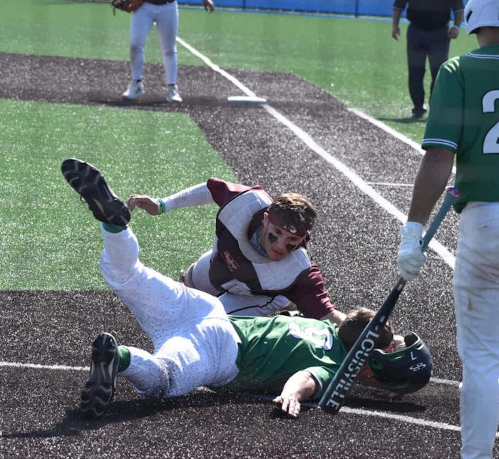 Dunkirk catcher Gabe Valentine tags out Lewiston-Porter’s Brandon Tamul.
