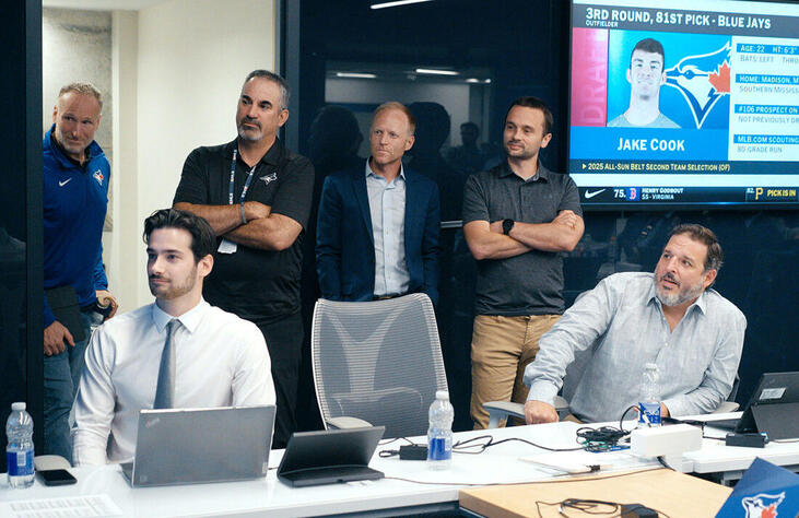 Marc Tramuta, Toronto Blue Jays director of amateur scouting, third from left; and Michael Youngberg, Blue Jays manager of amateur player evaluation, fourth from left.