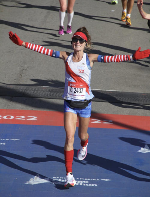 Jennifer Giebner-Donato crosses the finish line at the Chicago Marathon. Submitted Photo.