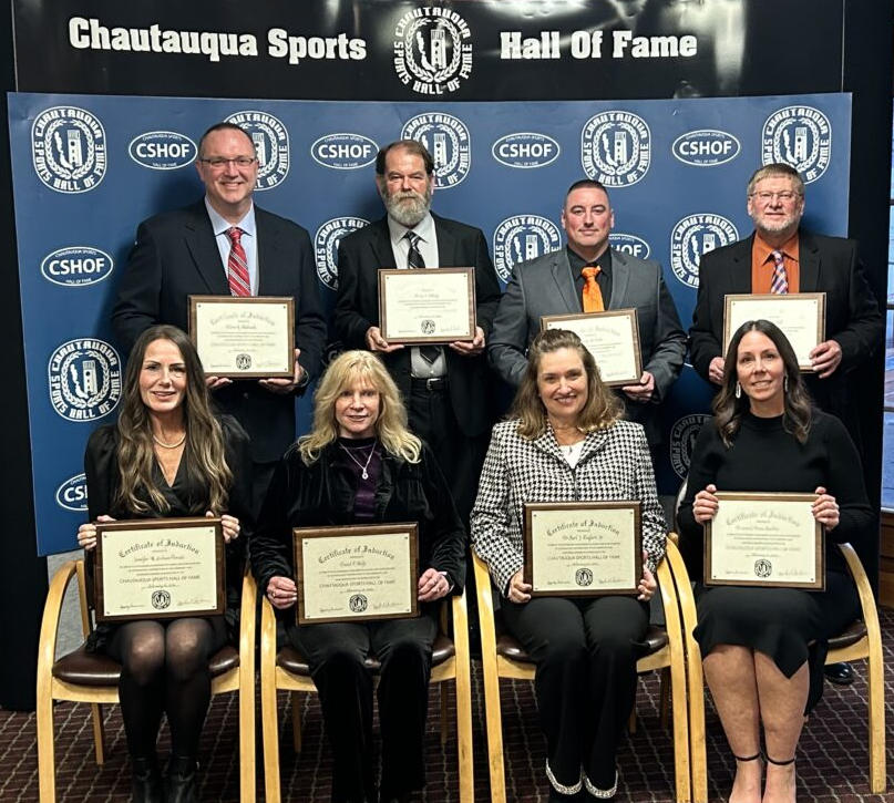 Above is the 2026 inductee class. Seated, from the left, are Jennifer Giebner Donato; Mary Bouquin, sister of late inductee Dan Wolfe; Kyle Herr, daughter of late inductee Karl Englert; and Brianne Prince Hazelton. Standing are Trevor Hitchcock, Kerry Kellogg, Kenny Betts and Brian Hull. P-J photo by Scott Kindberg