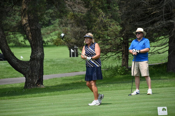 Cindy Miller tees off.