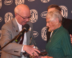 2024 inductee Judy Young is congratulated by CSHOF president Randy Anderson upon her enshrinement. 2024 inductee Judy Young is congratulated by CSHOF president Randy Anderson upon her enshrinement.