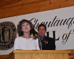 Paula Bataitis Kirsch and Mark Bataitis accepting the induction of their father, George Bataitis, into the CSHOF. Bataitis