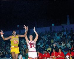 George Carter of the Pittsburgh Condors defends against Rick Barry of the New York Nets during the 1971-1972 American Basketball Association season. George Carter guards RickBarry