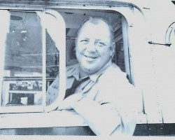 John Newman driving city bus, circa 1961. John Newman driving city bus, circa 1961.