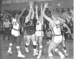 Donn Johnston #50 and his teammates swarm Dunkirk's Dave Criscione. 1969. Donn Johnston #50 and his teammates swarm Dunkirk's Dave Criscione. 1969.