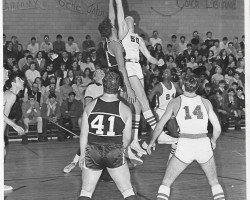 Donn Johnston reaches for the tip. 1968. Donn Johnston reaches for the tip. 1968.