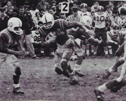 Dan Wolfe carries the ball, 1967. Dan Wolfe carries the ball, 1967.