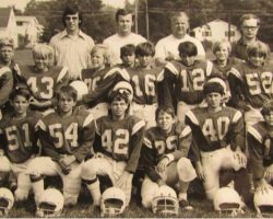 Mike Lopriore, front row, far left, as a volunteer coach for the 1972 Eastside Eagles of the Jamestown Area Midget Football League. Other coaches, in the back row, from left to right, are Steve Sampson, Gary Peters, Russ Bloomquist, Bill Brown and Randy Bloomquist. 1972 Eastside Eagles.