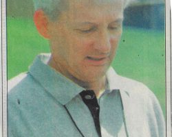 (P-J Coach of the Year) Chautauqua Lake Coach Cal Cederquist checks one of his runner's time. <em>Post-Journal</em> (Jamestown), 1998. (P-J Coach of the Year) Chautauqua Lake Coach Cal Cederquist checks one of his runner's time. 1998.