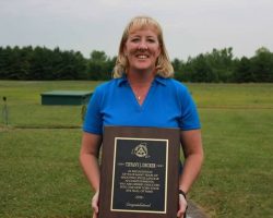 Tiffany Decker with her New York State Amateur Trap Association Hall of Fame plaque, July 14, 2018. Tiffany Decker with her New York State Amateur Trap Association Hall of Fame plaque, 2018