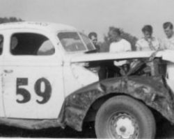 Lloyd Moore, second,from left, near the windshield,
wearing a t-shirt, with his head turned. Julian Buesink is in front of the car adjusting the tow bar. Dunkirk, NY, 1950. Lloyd Moore, second,from left, near the windshield, wearing a t-shirt, with his head turned. Julian Buesink is in front of the car adjusting the tow bar. Dunkirk, NY, 1950.