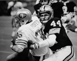 Crist tackling Hofer, 1976. Crist tackling Hofer, 1976.
