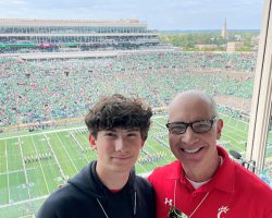 Inductee Dan Hoard broadcasted the Cincinnati Bearcats upset win over Notre Dame on 10-2-21. The photo shows Dan and his son Sam at Notre Dame Stadium prior to the game. Dan and his son Sam at Notre Dame Stadium