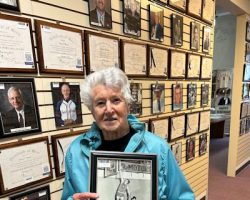 Judy Young holds a photo of her son Jim, a 2013 CSHOF inductee. 2023. Judy Young holds a photo of her son Jim, a 2013 CSHOF inductee. 2023.