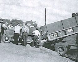 Lloyd Moore unloading his car from a coal truck in 1949. Lloyd Moore unloading his car from a coal truck in 1949.