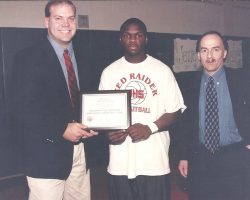Tom Meyers, left, and Sam Baglia of McDonald's Restaurants
present a certificate to Maceo Wofford recognizing him as a nominee for the 1999 McDonalds All-American basketball team. McDonald's All-America nominee 1998