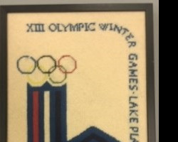 A cross stitch Jim's mother made for him in honor of his assignment to cover the 1980 Olympics. Olympic cross stitch